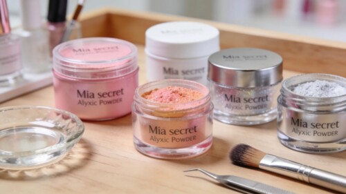 Mia Secret acrylic powders and tools on a nail technician's workstation